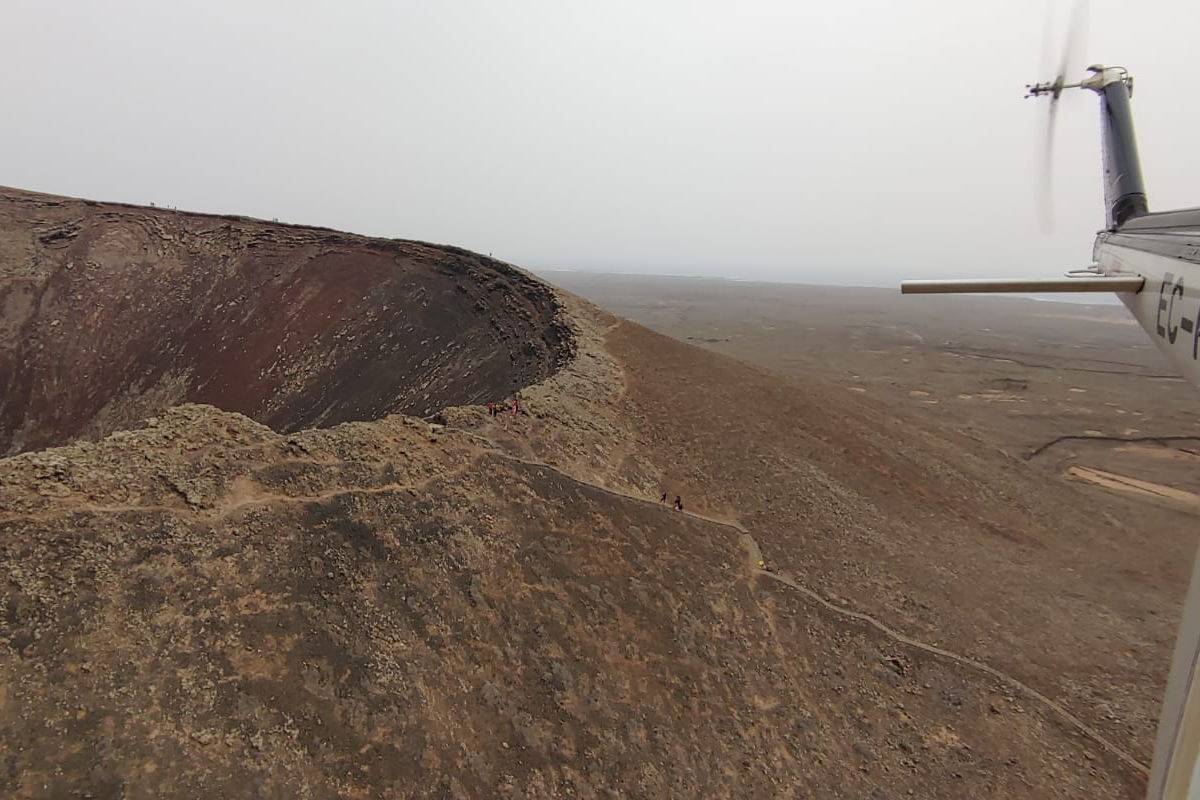 Woman rescued by helicopter after falling into the crater of a volcano